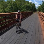 Myrna biking on the Gandy Dancer Trail