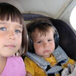 My kids in the back of our Piper Pacer