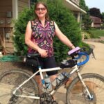 Woman standing next to Salsa Vaya gravel bike