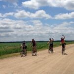 Four women gravel bikers biking together