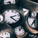 Many brown and white clocks